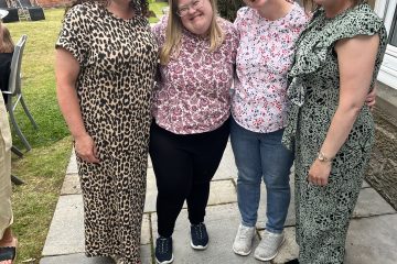 Staff and residents relaxing together during Westlands Family Fun Day 2023