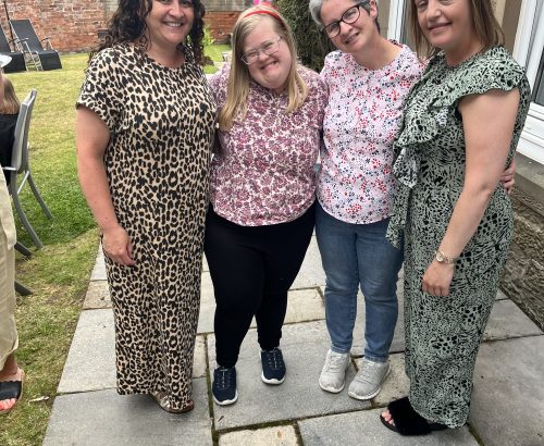 Staff and residents relaxing together during Westlands Family Fun Day 2023